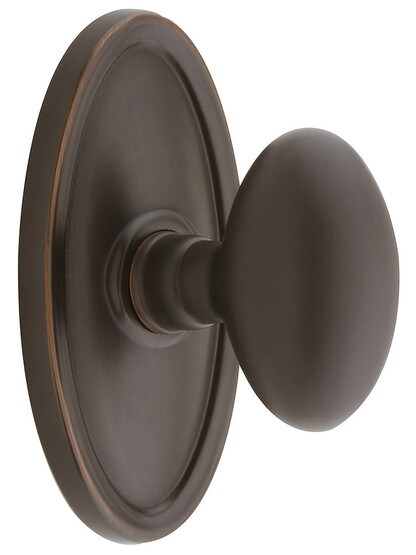Oval Rosette Set With Elliptical Brass Knobs in Oil Rubbed Bronze.
